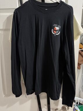 Nike Black Long Sleeve Tee with Small Orange Crest Graphic